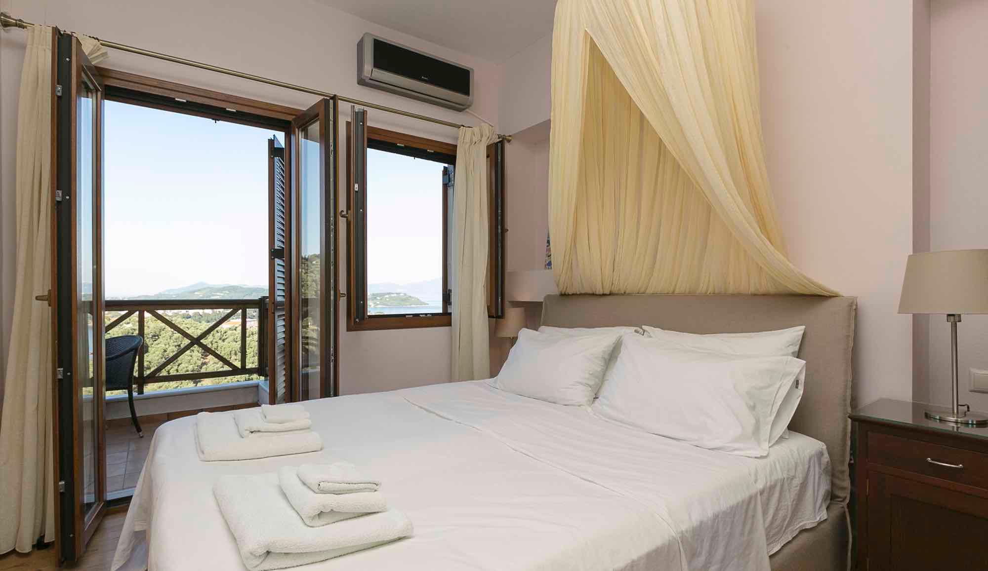 Villa Anemoessa bedroom with double bed and mountain view